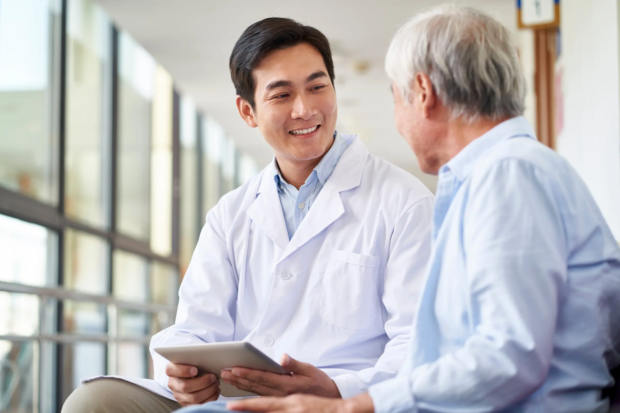 Doctor consulting with senior patient
